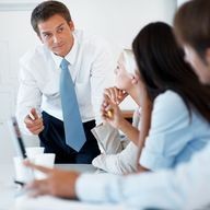 Young businessman discussing working ideas with colleagues